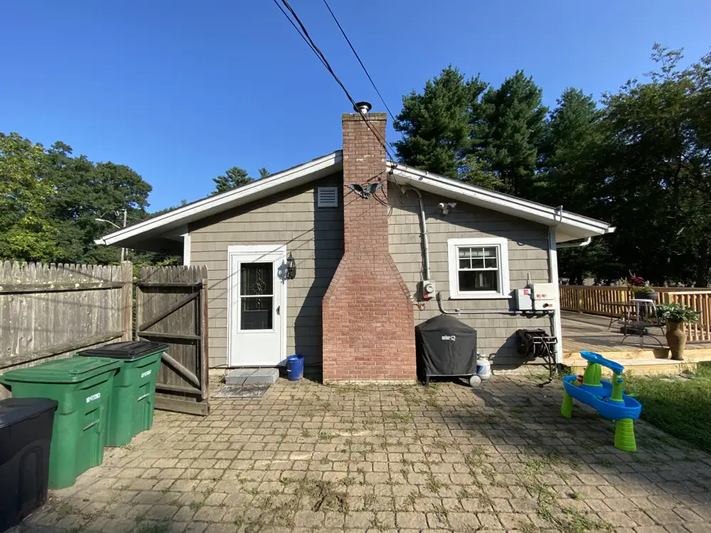 Backyard with brick chimney and paver patio