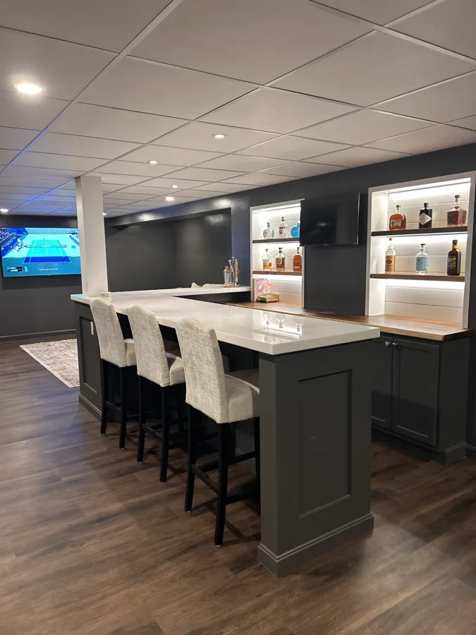 Finished basement bar with shelving